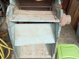 a picture of an old washer with a basket on top of it