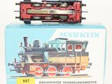 a box with a toy train on it on a white surface