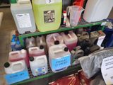 many different types of plastic jugs and containers on the shelf