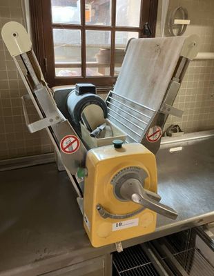 a machine that is sitting in a kitchen next to a window