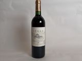 a bottle of wine that is sitting on a table