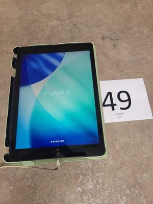 a tablet that is sitting on the floor next to a price tag