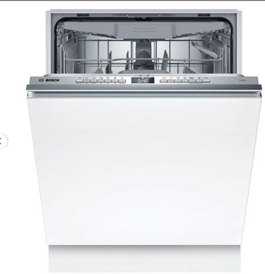 un lave-vaisselle blanc posé sur un comptoir blanc