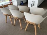 four chairs that are sitting in a room together