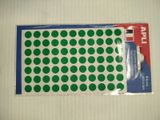 un paquet d'autocollants verts à pois sur un fond blanc