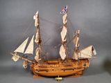 a model of a sailing ship on display on a table