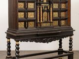 an image of a wooden cabinet with a cross on top of it