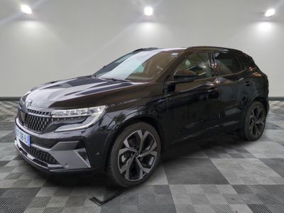 a black suv parked on a checkered floor in a garage