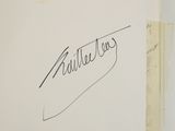 a close up of a piece of paper with a signature on it