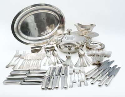 a lot of silverware on the table and silverware on the table