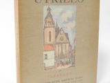 an old book with a picture of a church on the cover