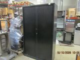 a black cabinet in the middle of a room