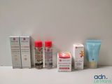 many different types of skin care products displayed on a table