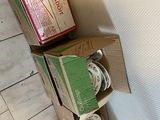 a stack of boxes on top of a toilet in a bathroom
