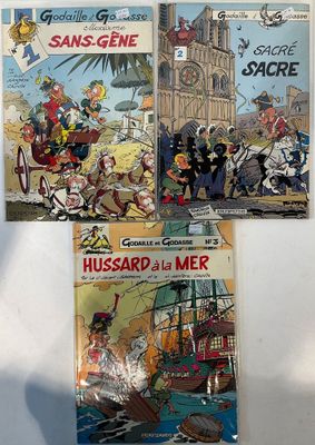 trois livres posés sur une surface blanche, avec une tour horloge en arrière-plan