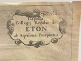 an old book with a picture of a town on it
