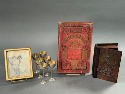 several items including a book, a wine glass, and a picture of a woman