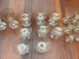 many empty wine glasses sitting on a wooden table