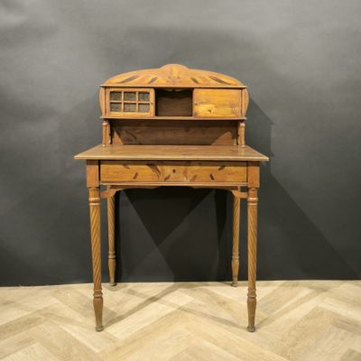 an old wooden desk with a drawer on top of it
