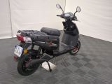 a scooter that is parked in a garage