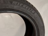 a close up of a tire on a white surface