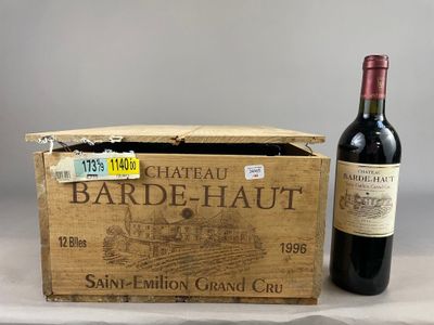 a bottle of wine sitting next to a box of wine
