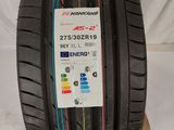 a close up of a tire on top of a cardboard box