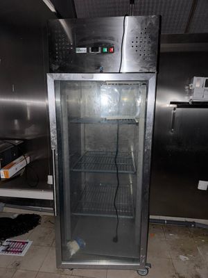 an image of a commercial refrigerator in a kitchen