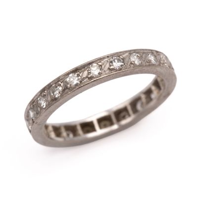 a close up of a diamond ring on a white background