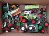 a cardboard box filled with different types of toys