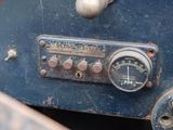 a close up of a gauge on the dashboard of an old car
