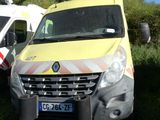 several ambulances are parked in a grassy field with trees in the background