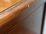 a close up of a desk with a wooden top