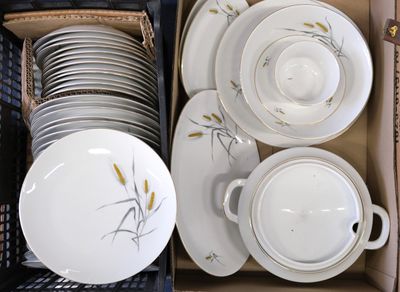 many plates and bowls in a box together