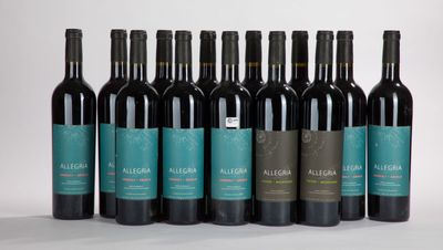 several bottles of wine are lined up in a row