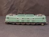 a green train car that is sitting on a table