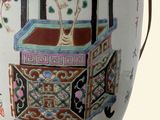 a vase that has flowers in it on a stand