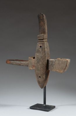 an image of a wooden sculpture of a plane on a stand