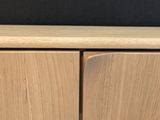 a close up of a wooden cabinet with a black background