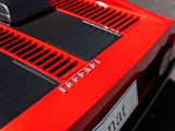 a close up of the hood of a red sports car