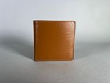 an image of a brown wallet sitting on top of a table