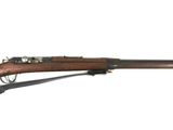 a rifle with a wooden barrel on a white background
