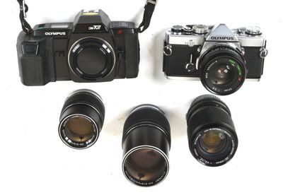 three cameras that are next to each other on a table