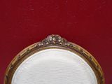 an image of a chair with a red wall in the background