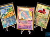 four different pokemon cards are displayed in a row on a black background