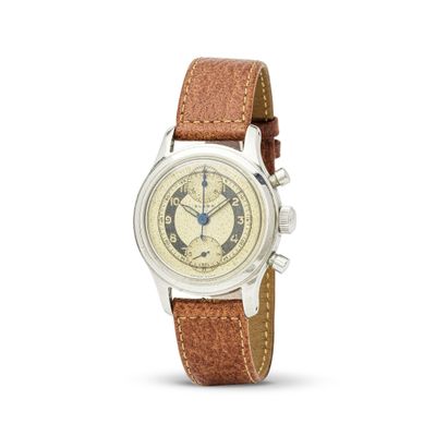 gros plan d'une montre sur fond blanc avec un bracelet marron