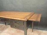a wooden desk with two drawers and a drawer underneath it