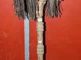 a wooden pole that has some kind of decoration on it