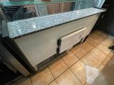 an image of a counter with a glass top in a restaurant