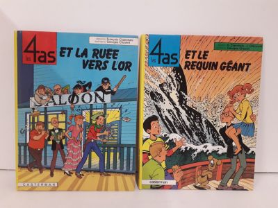 Deux livres pour enfants sont posés côte à côte sur une étagère.